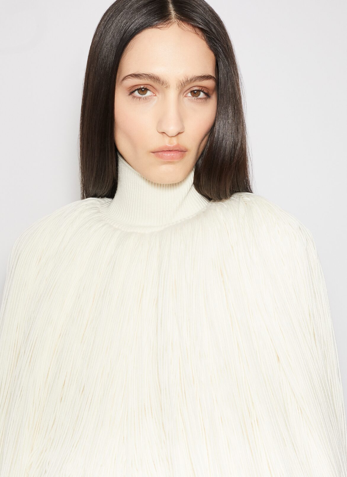 KNITTED FRINGES JUMPER ALAÏA OFF-WHITE KNITTED FRINGES JUMPER
